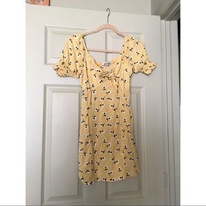 Pale yellow floral dress with ruched sleeves